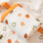 Couverture bébé en gaze de coton motif citrouilles orange
