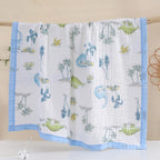 Couverture bébé en gaze de coton motif dinosaures bleus