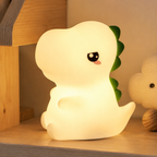 Veilleuse dinosaure diffusant une lumière blanc chaud